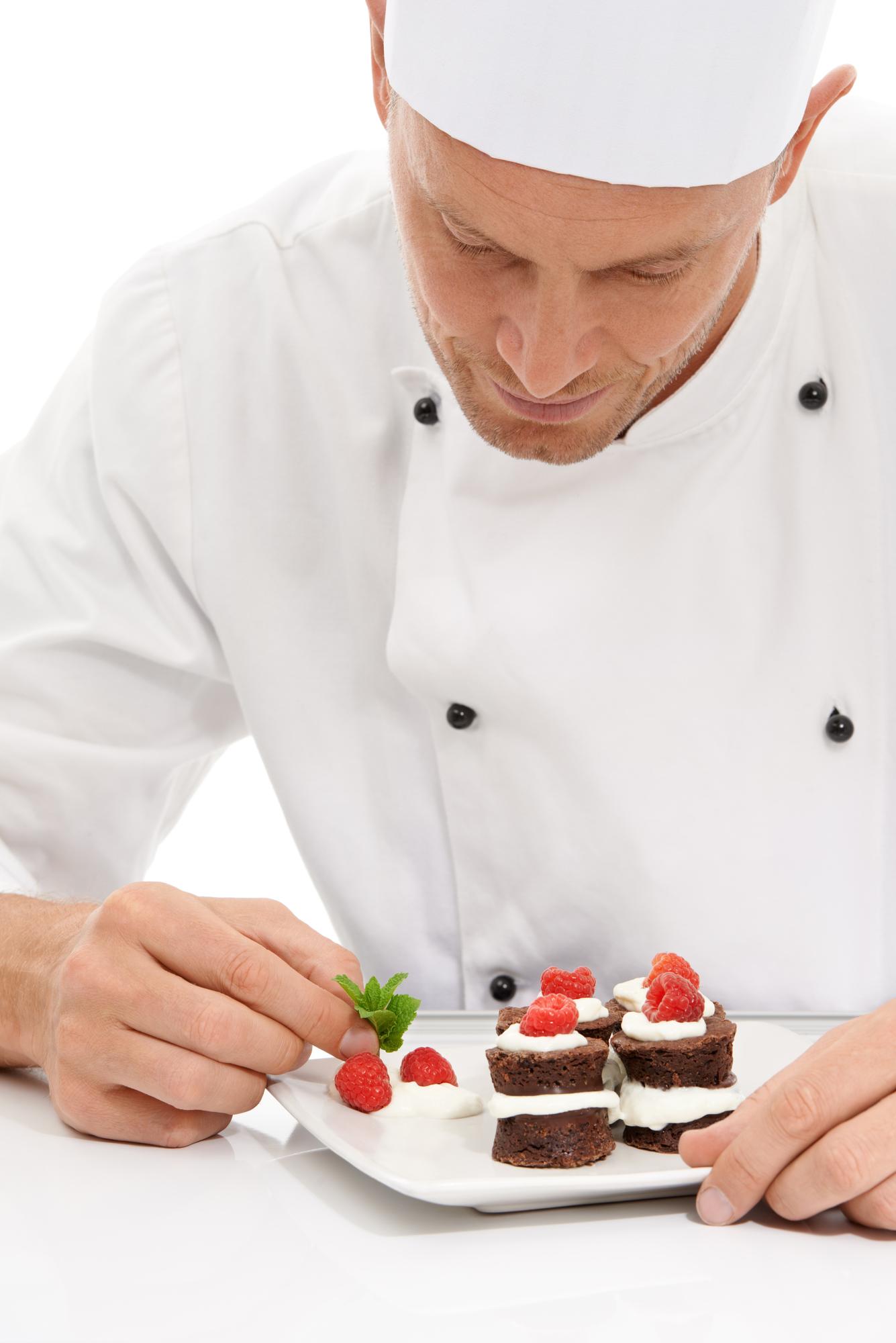 Pastry chef decorating dessert